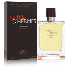 Hermès Terre D'Hermès Eau Intense Vétiver perfume bottle with its dark brown box packaging, displayed on a clean white background with a subtle reflection.