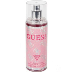 Guess fragrance mist bottle on a white background