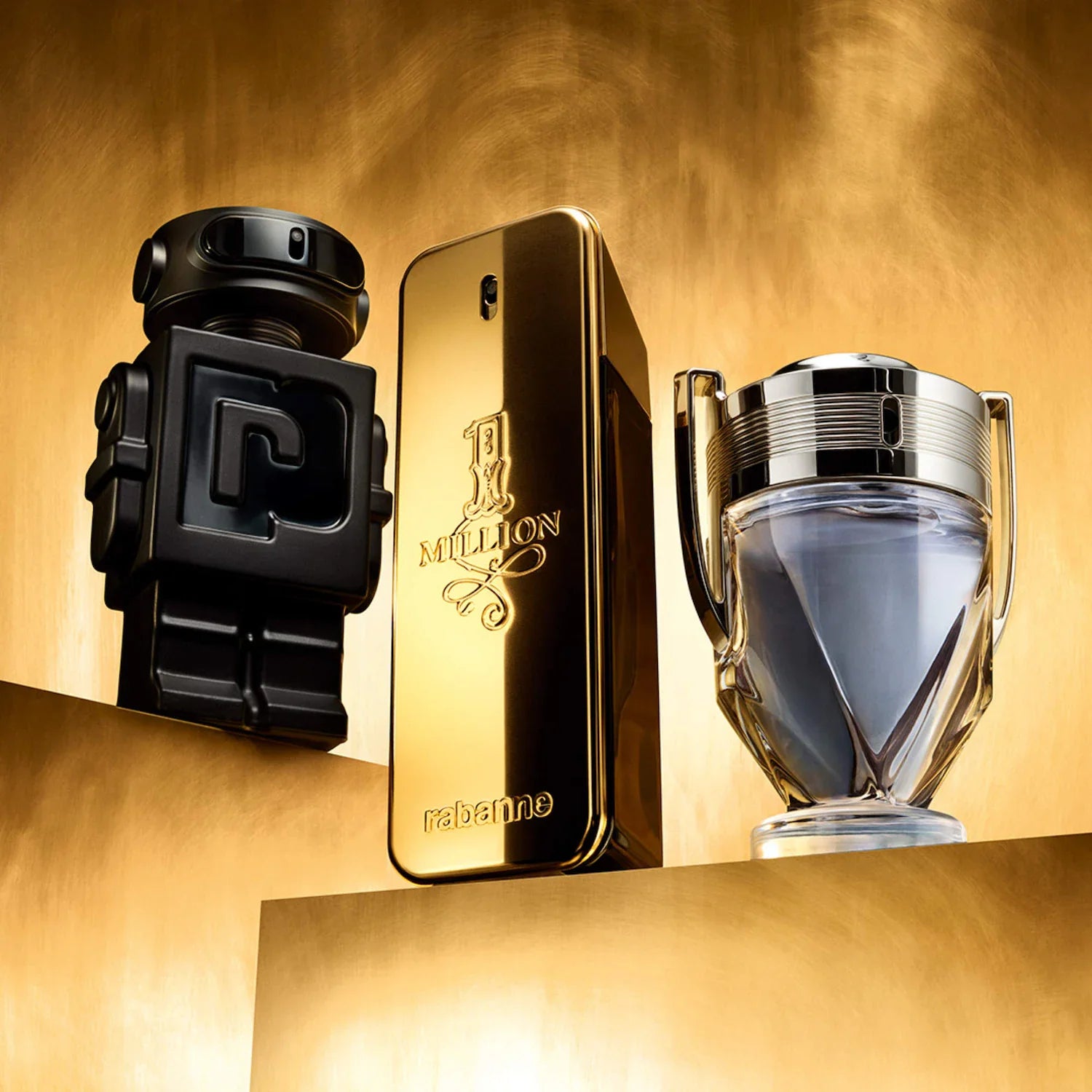 Three perfume bottles on a gold background with '1 Million' branding.